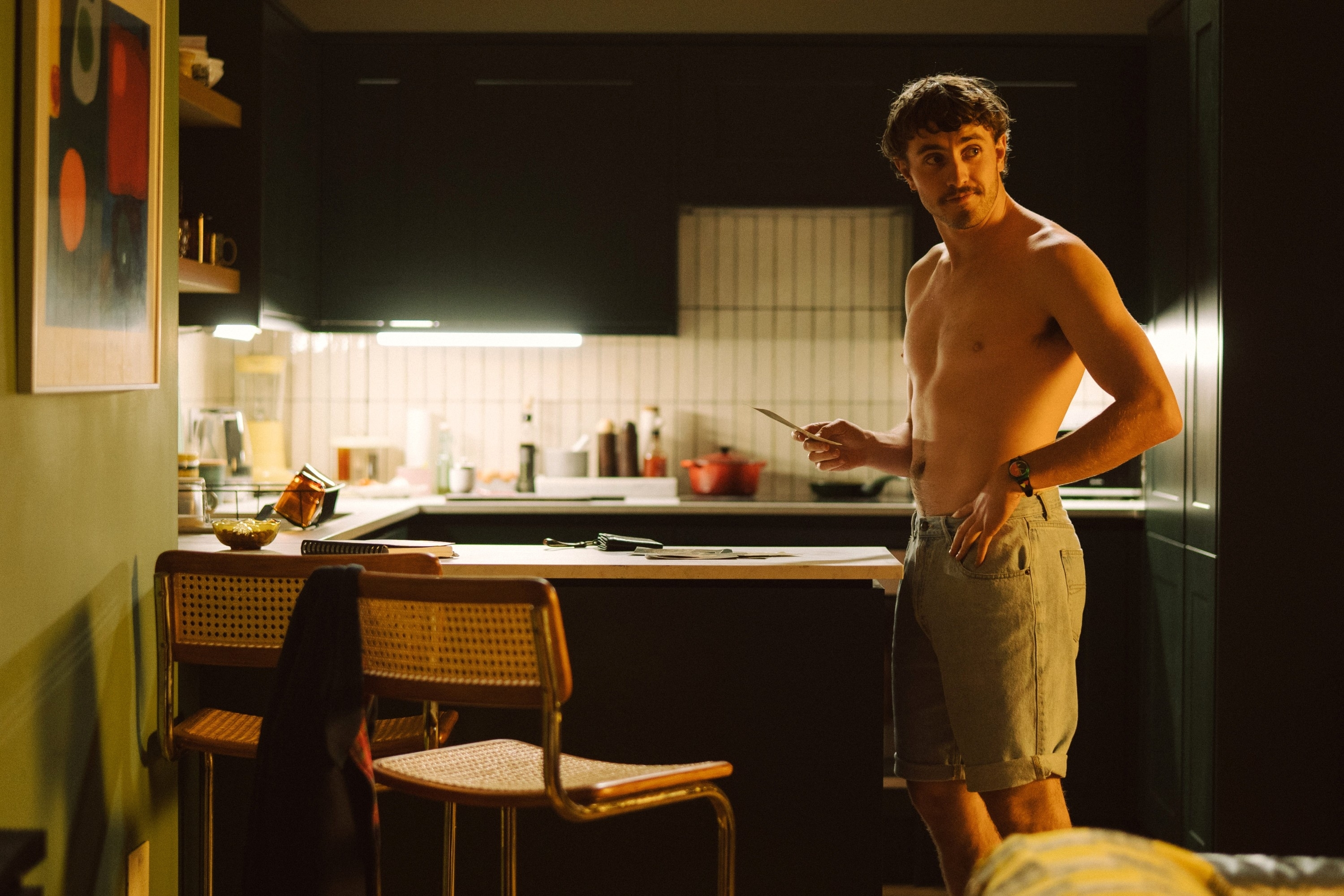 Paul&#x27;s character standing shirtless in a kitchen from &quot;All of Us Strangers&quot;
