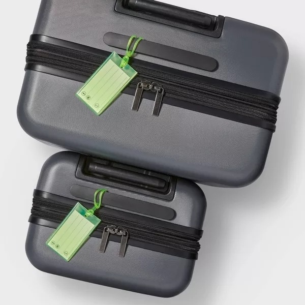 lime green luggage tags on suitcase