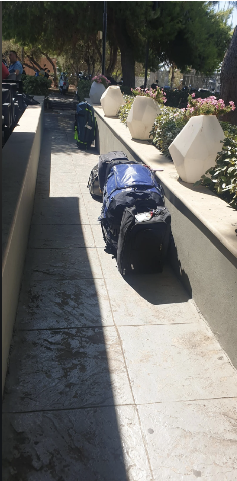 People&#x27;s luggage blocking a walkway