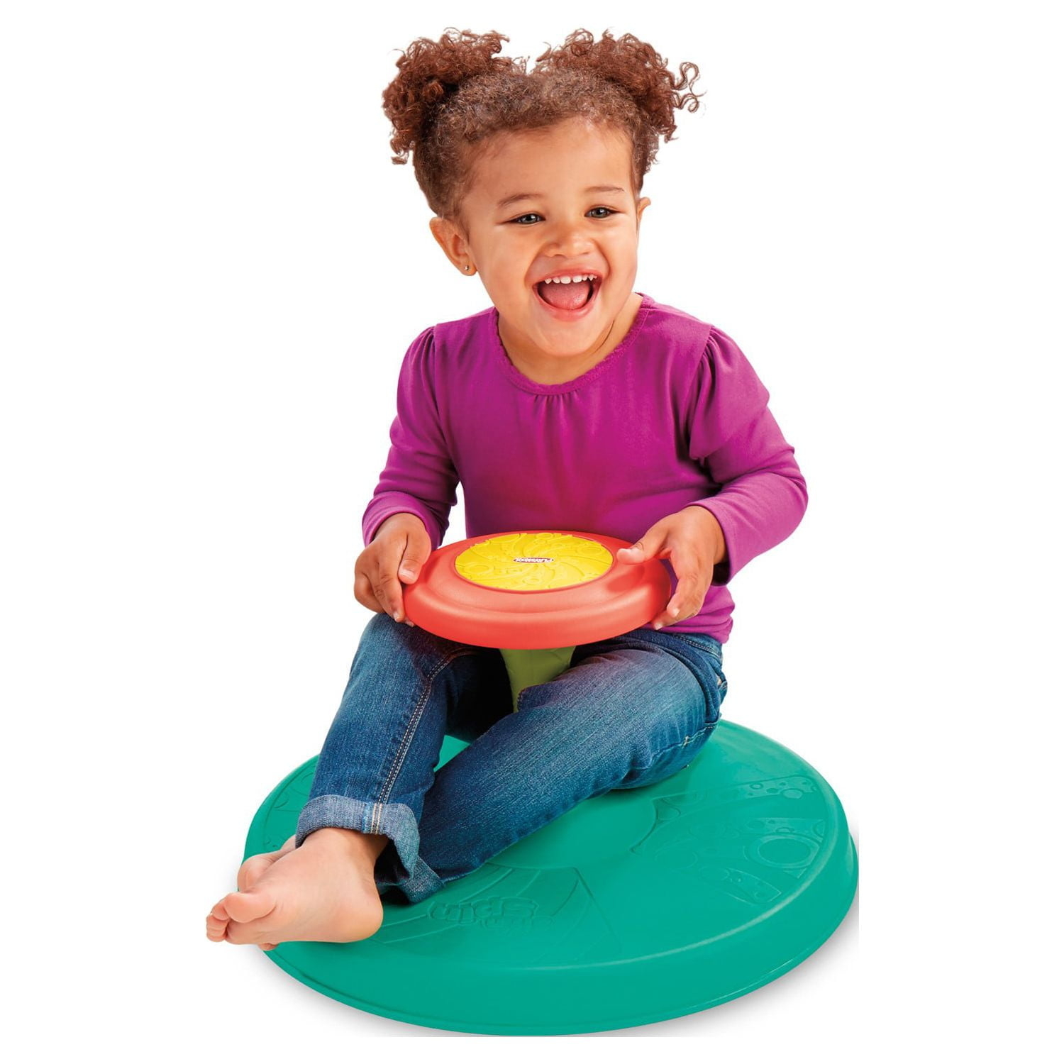 Toddler siting on circular spinning disc