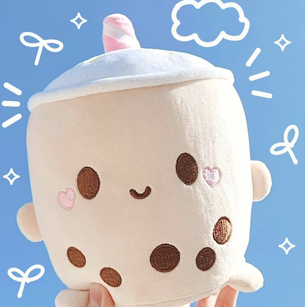 Cute bubble tea plushie being held up in the sky
