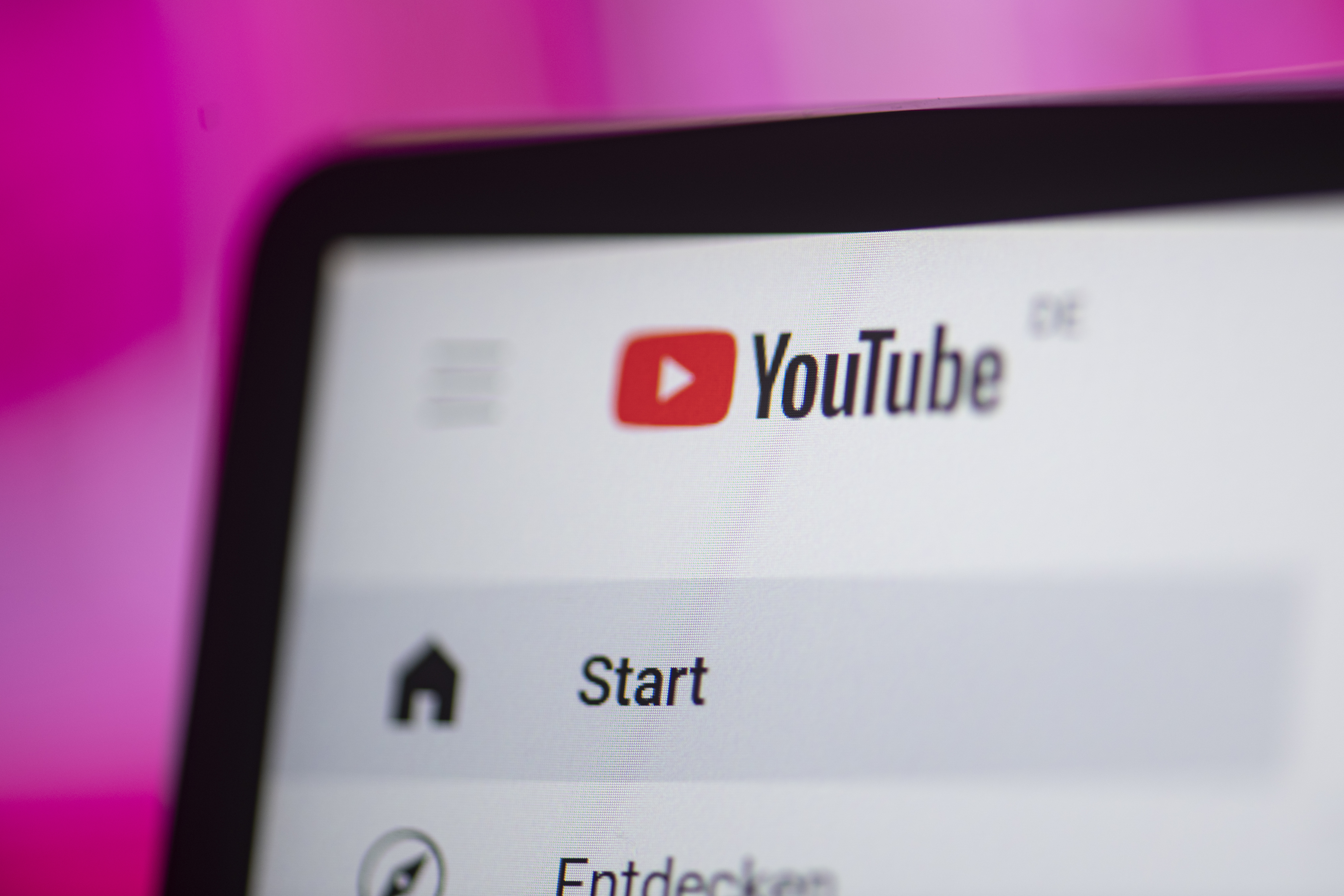an up-close shot of youtube open on a laptop