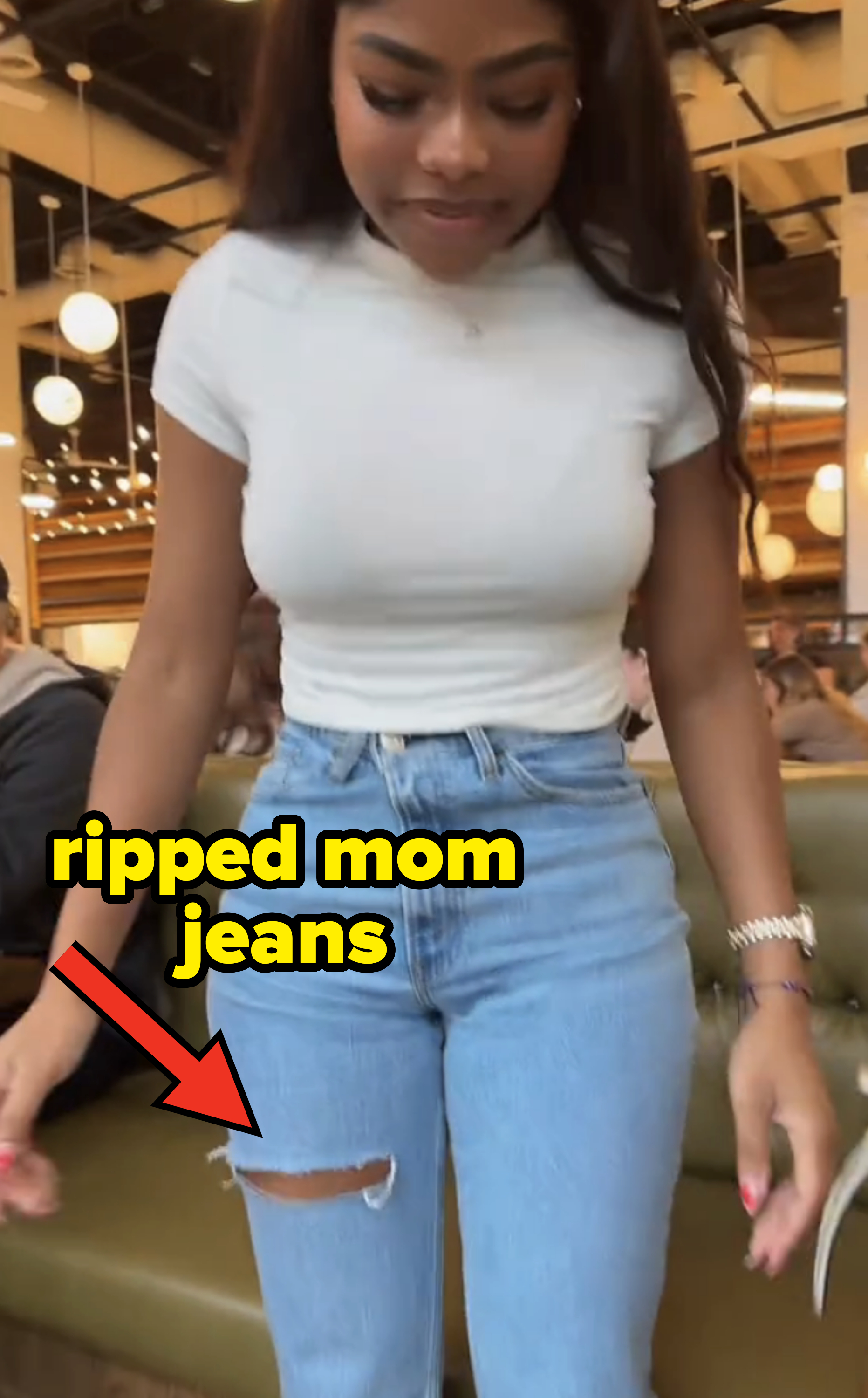 wearing ripped mom jeans