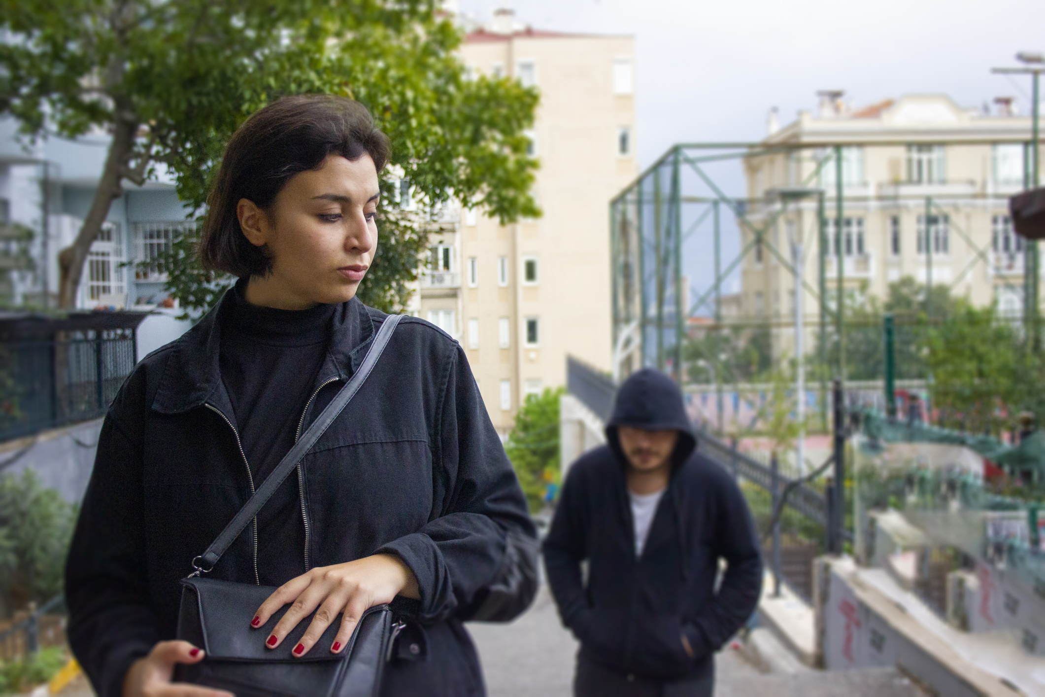 man following a woman