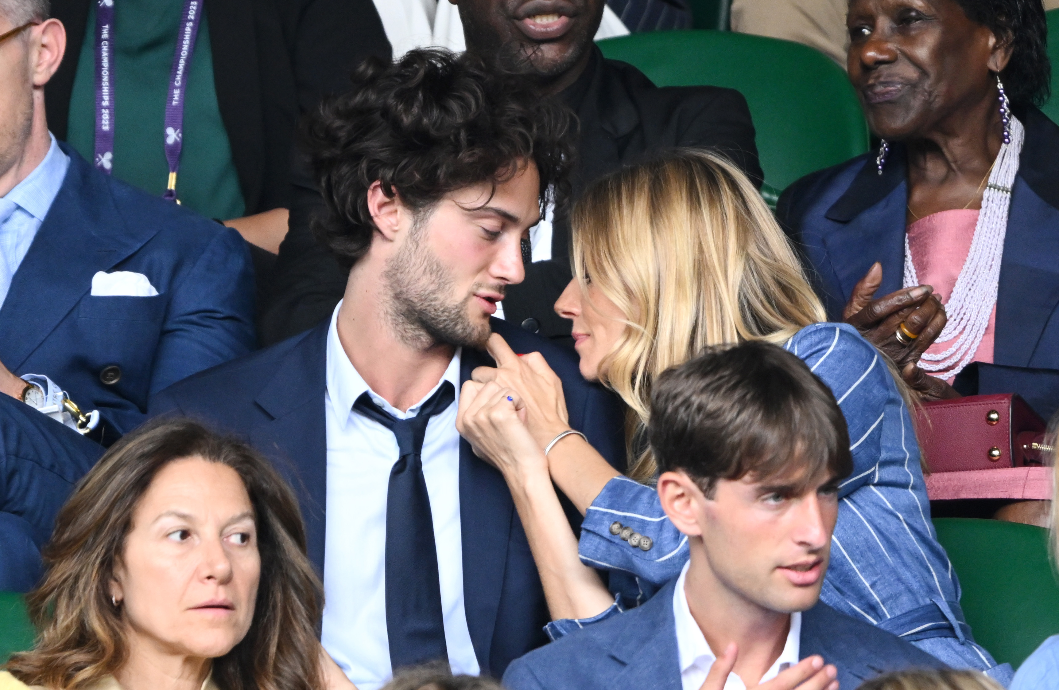 Oli Green and Sienna Miller in a crowd