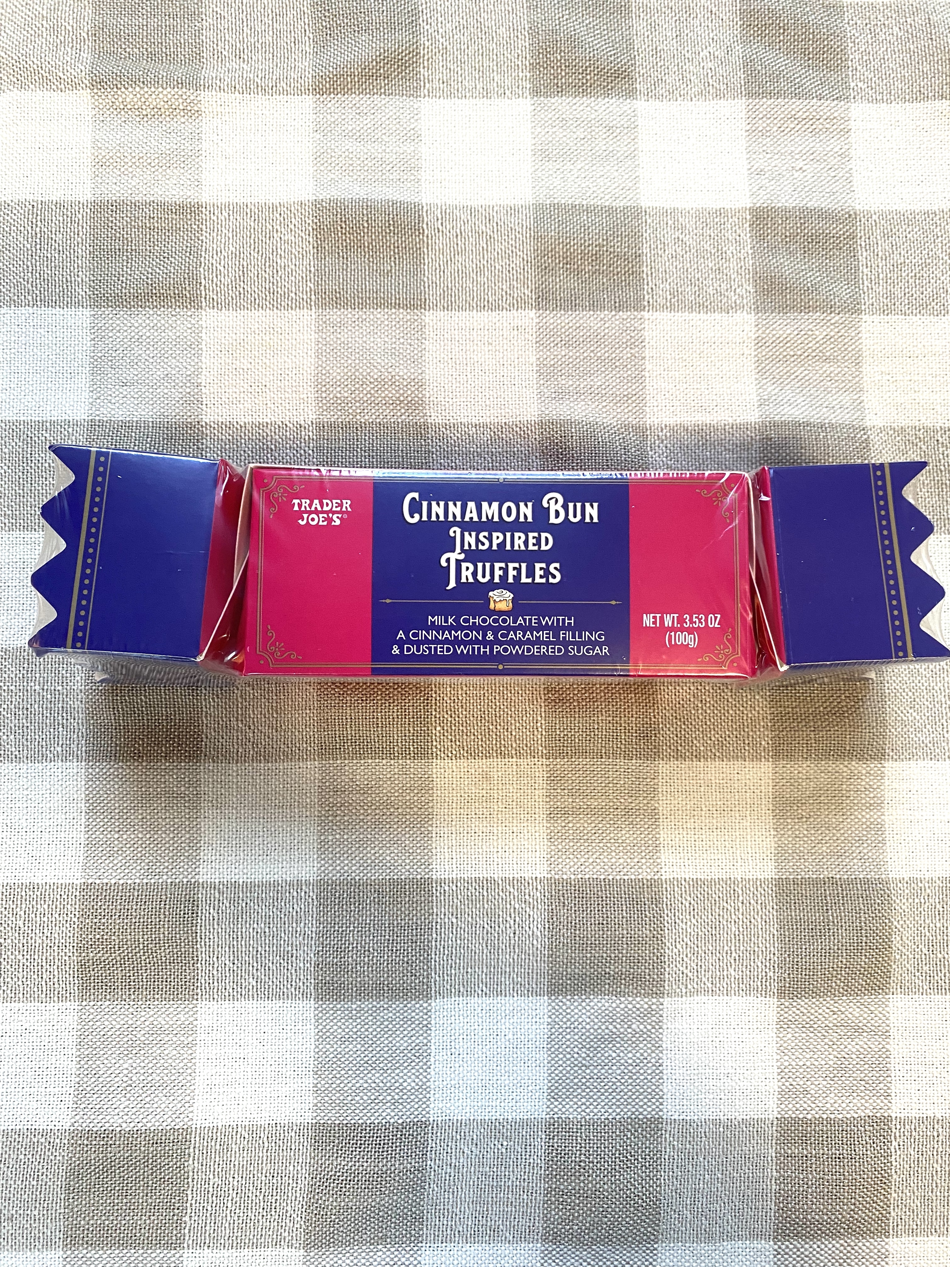 A package of Cinnamon Bun Inspired Truffles that resembles a a candy wrapper