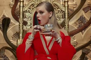 Taylor Swift holding a cup of tea in the Look What You Made Me Do music video