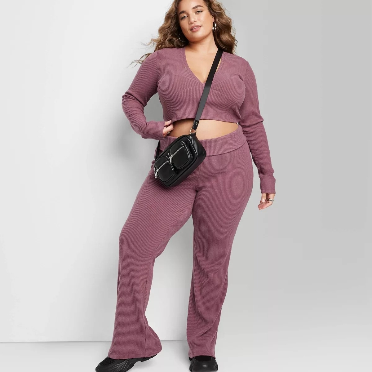 purple ribbed high waist flair pants on model