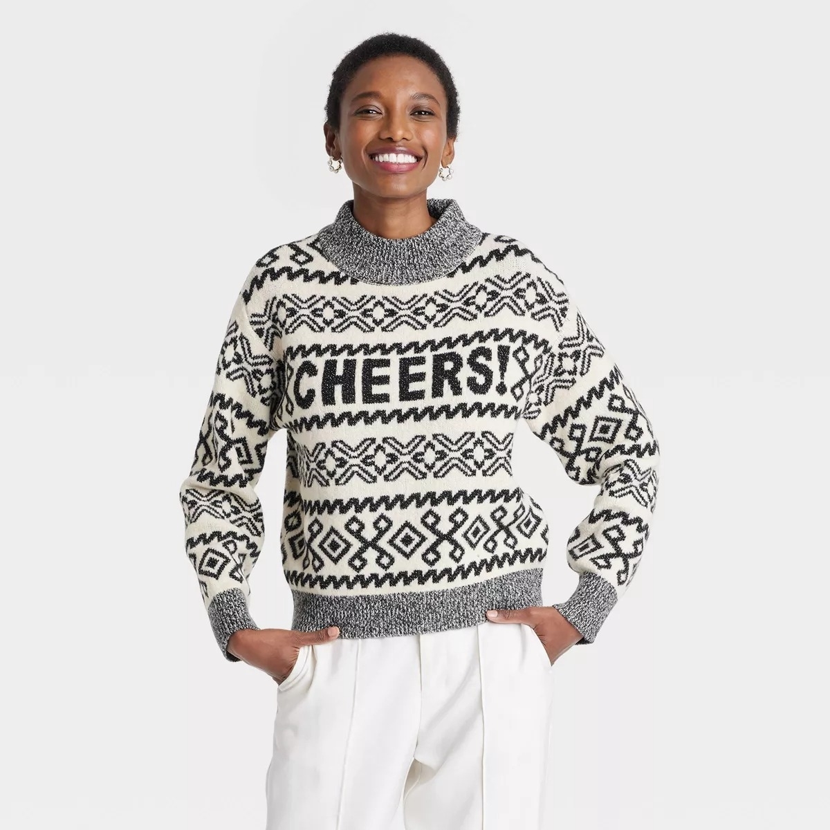 patterned black and white sweater on model