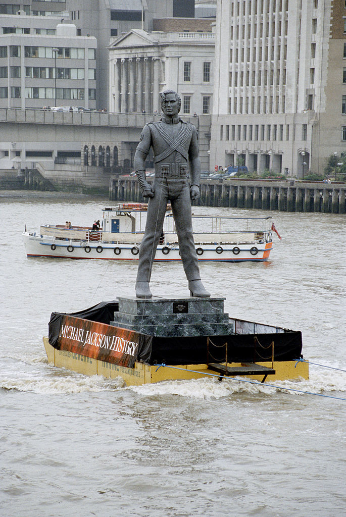 A Michael Jackson figure floating down the river