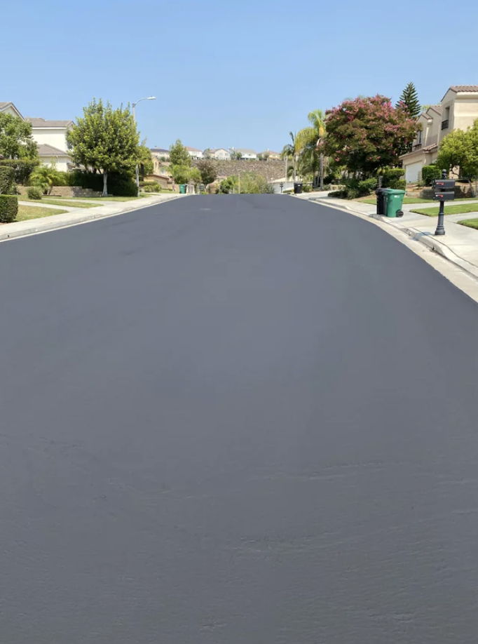 A perfectly smooth suburban road, no cars