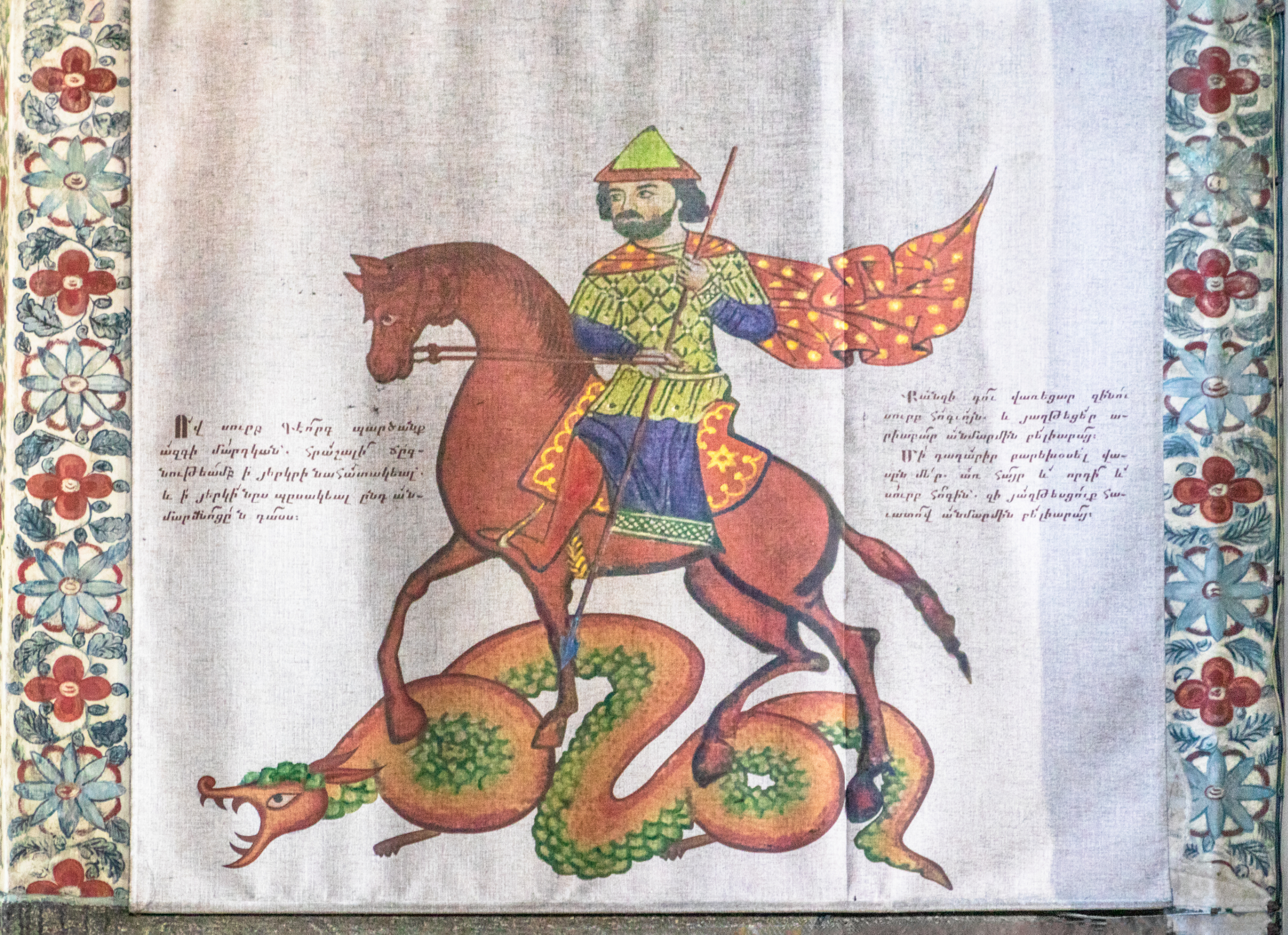 An old image of a man on a horse in colorful garments