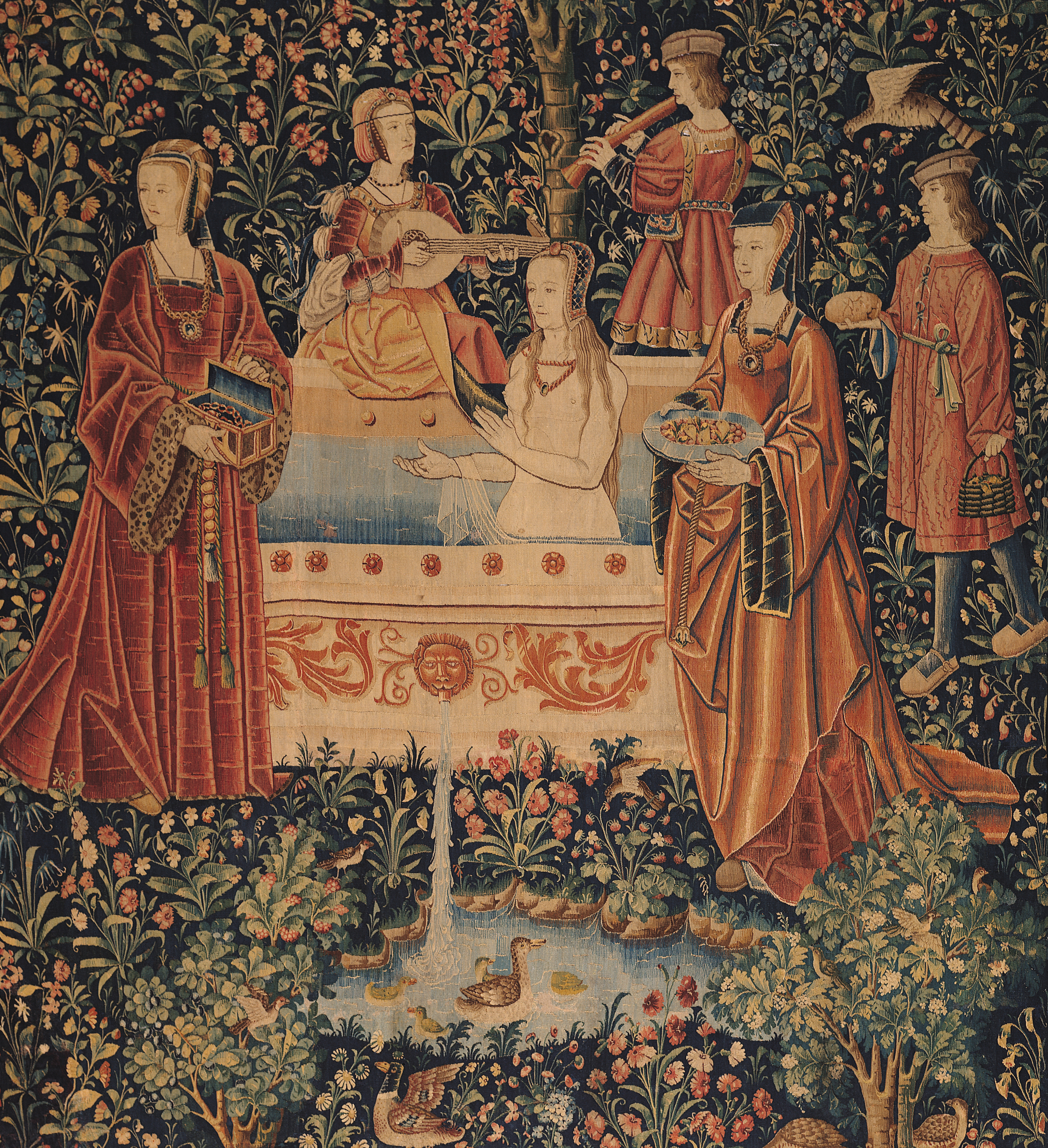 An old rendering of a woman in a bath being tended to by her servants