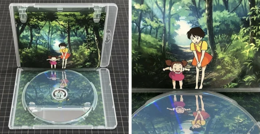 Two animated girls in the video reflected on the DVD surface
