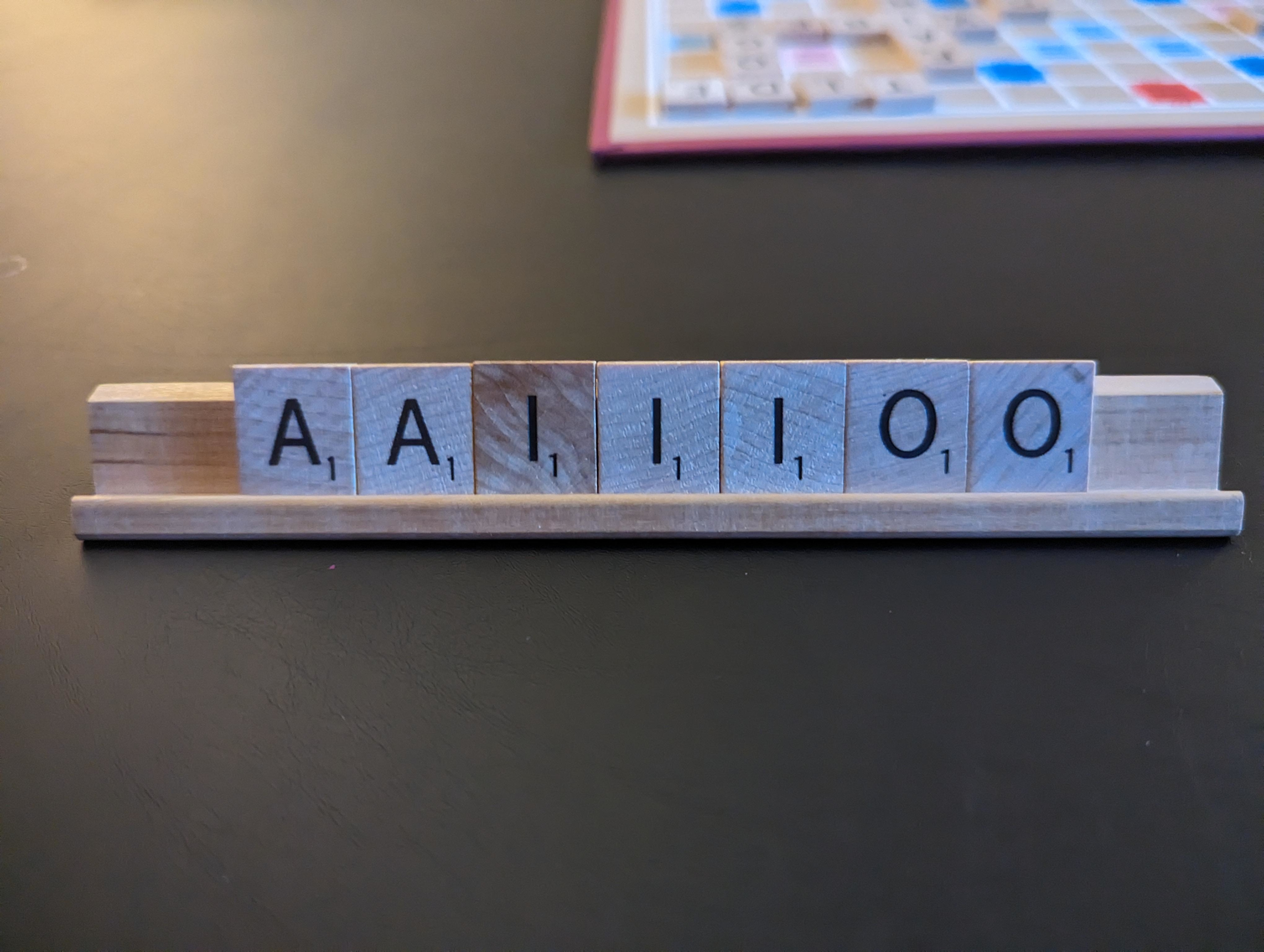 Scrabble tiles A, I, and O