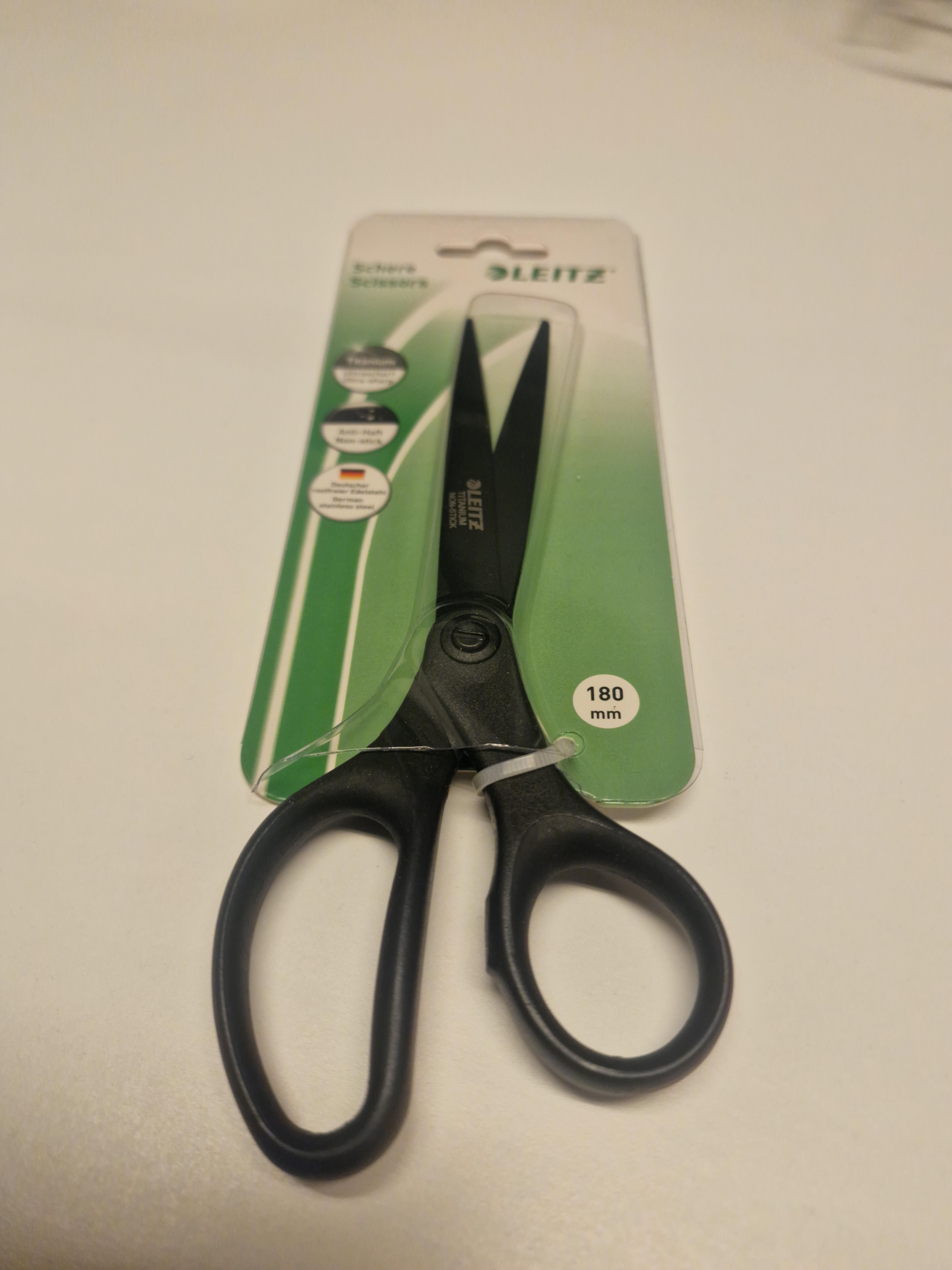 A pair of scissors packaged in such a way that you&#x27;ll need another pair to open it
