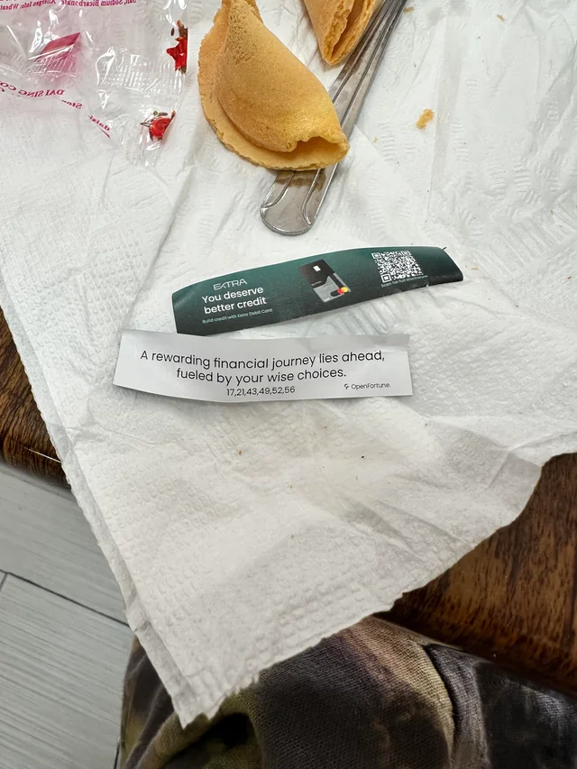 A fortune cookie with an ad inside