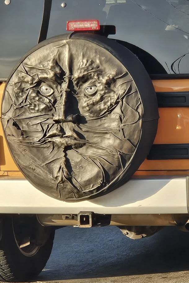 A face on someone&#x27;s tire cover