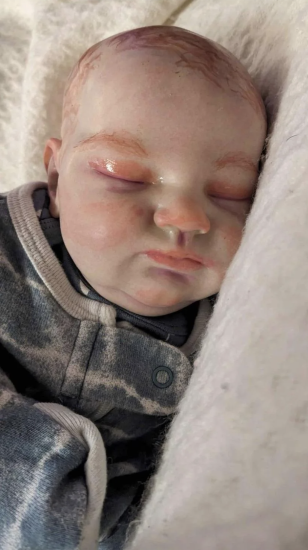 a realistic-looking baby doll