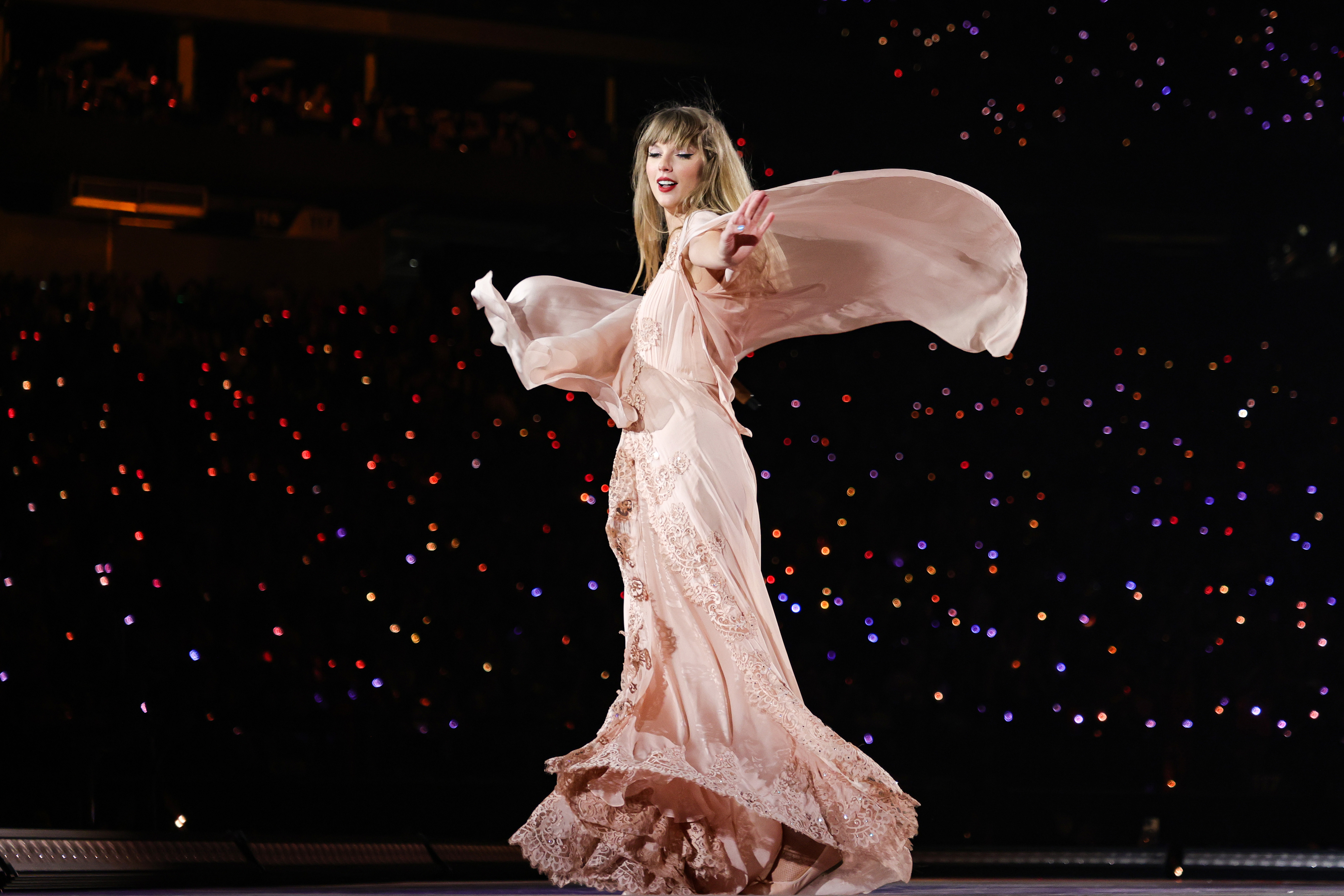 Taylor performing onstage in a gown