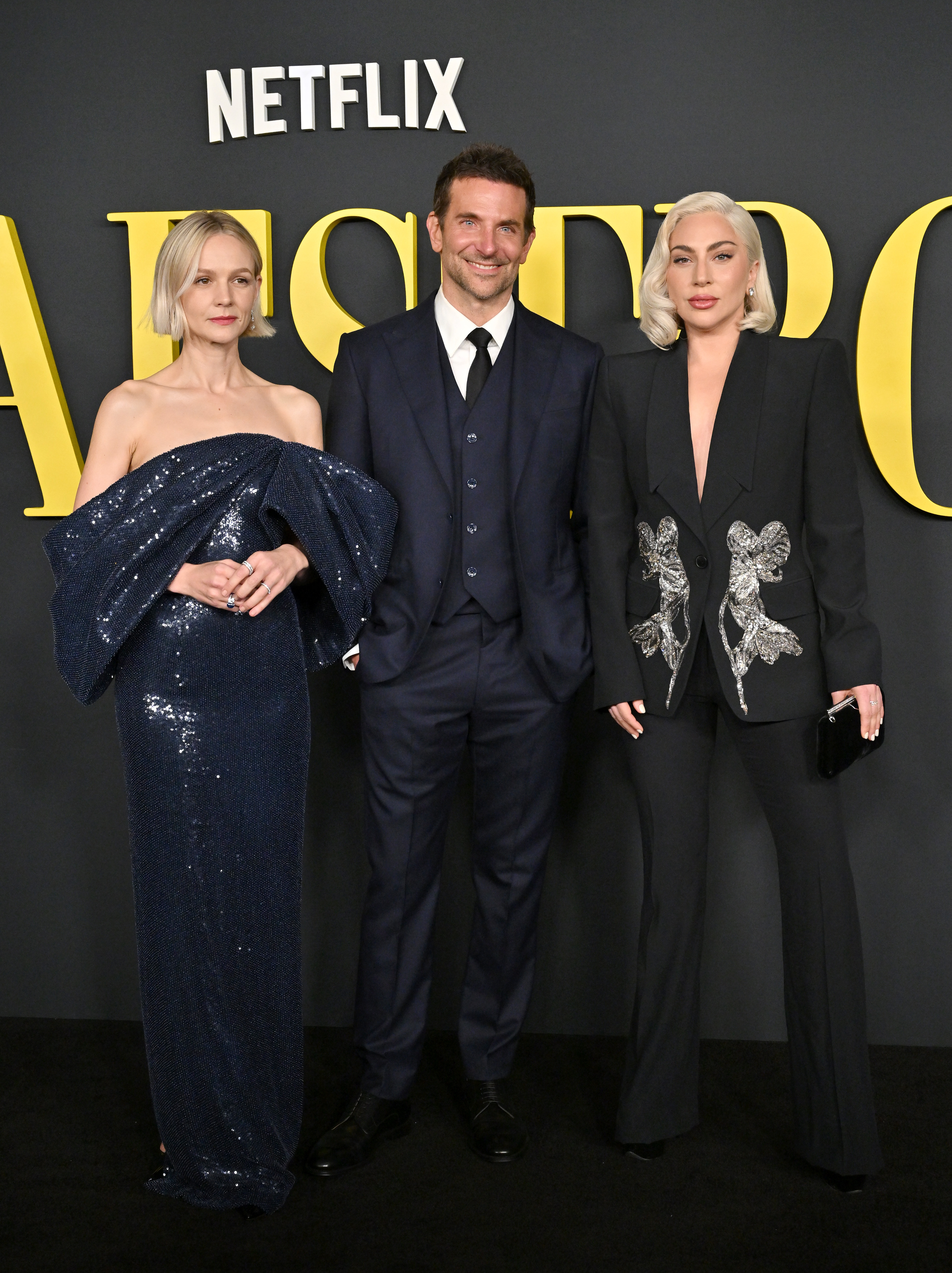 bradley standing in the middle of carey and lady gaga