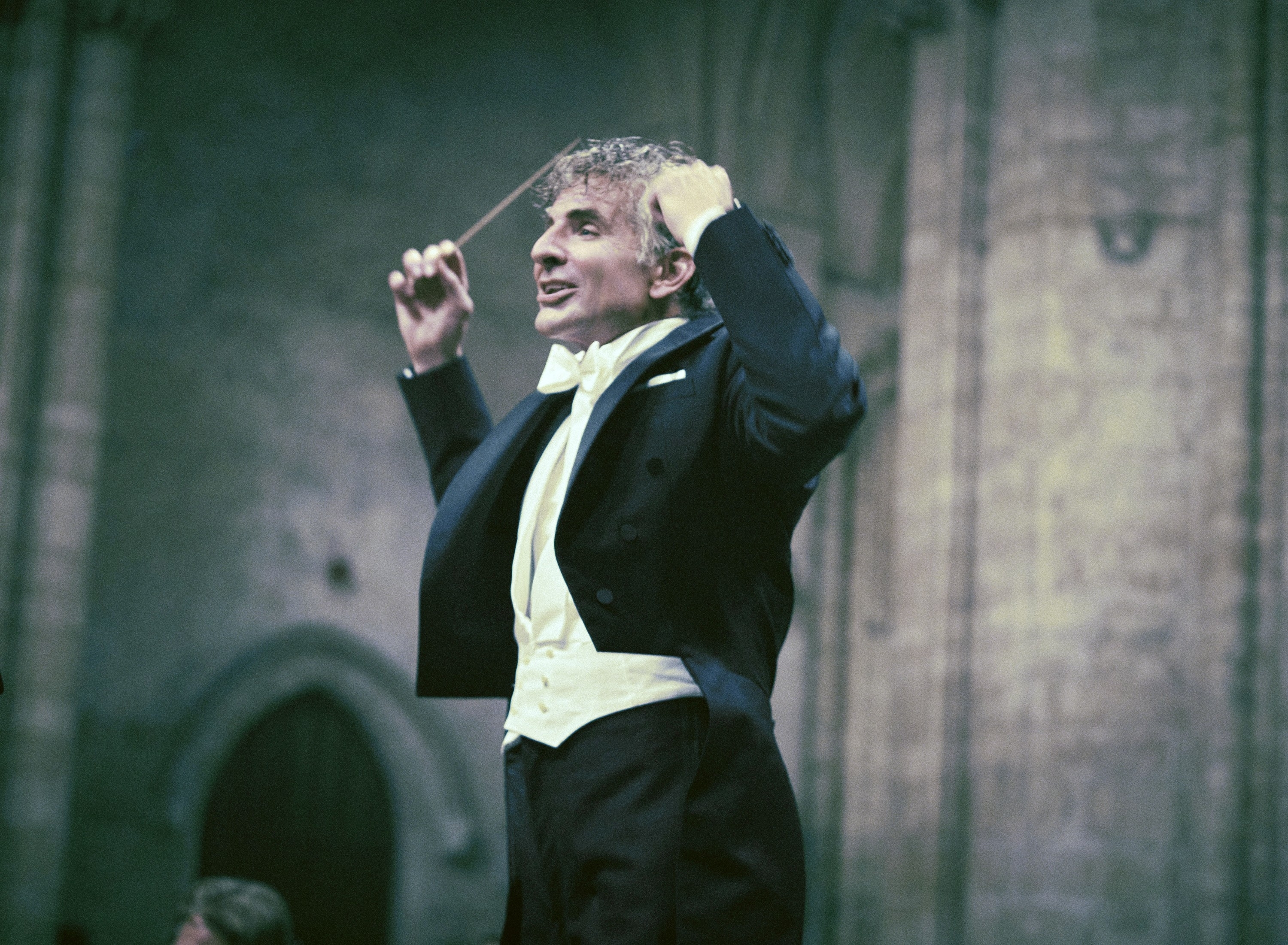 Bradley as Bernstein conducting an orchestra