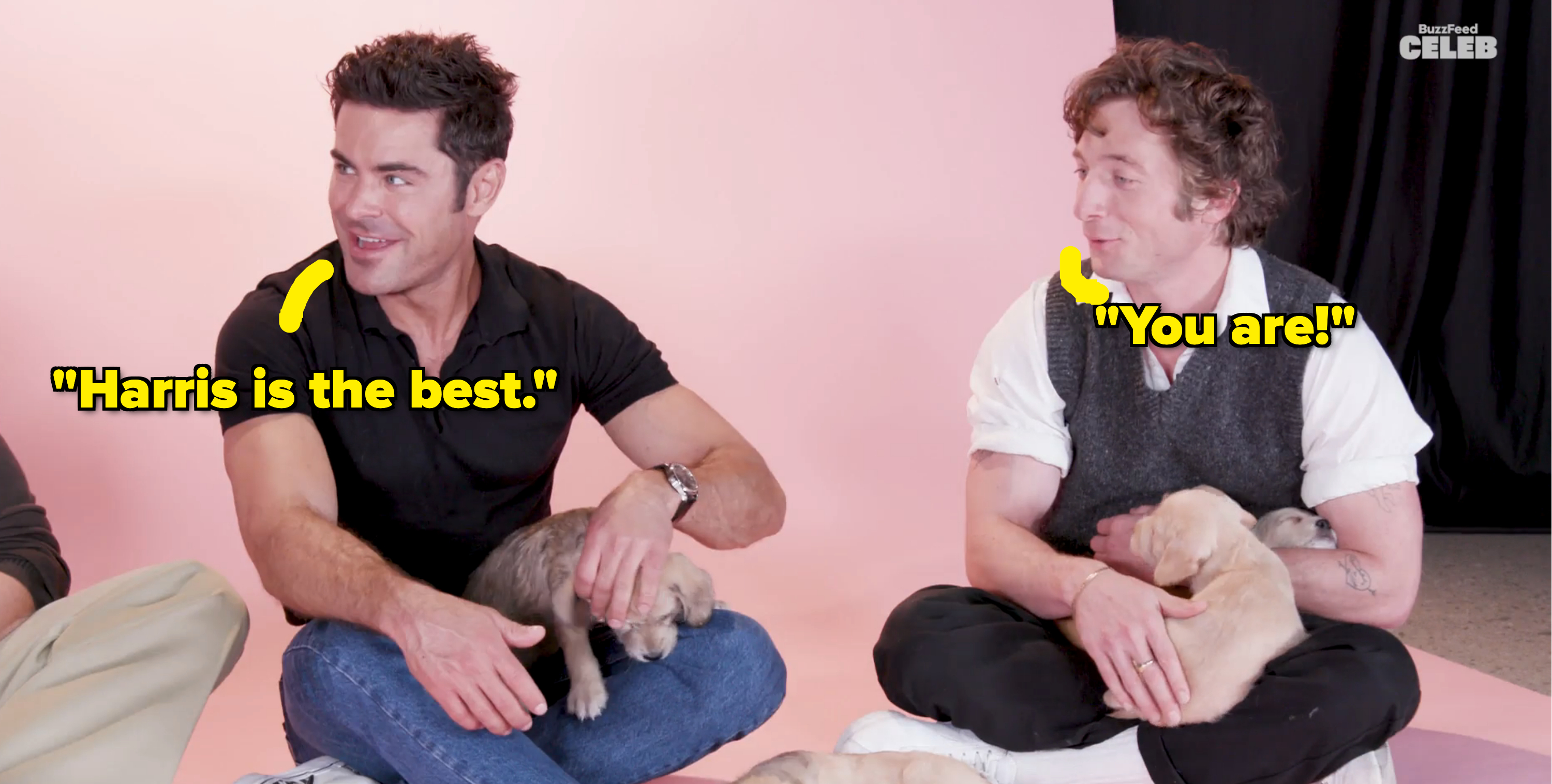 Closeup of Zac and Jeremy playing with puppies and saying how great Harris is at the signature claw move