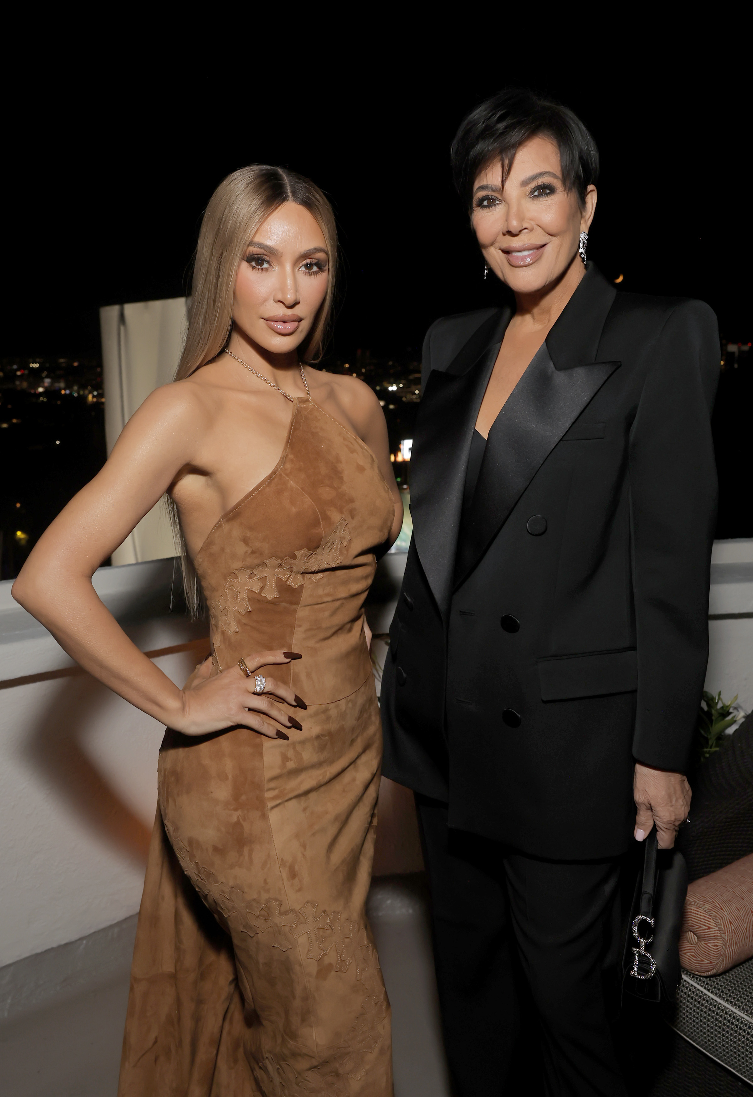 Kim and Kris posing for a photo together at an event