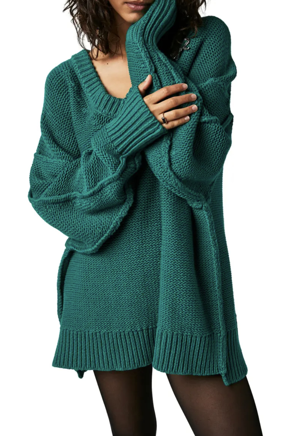 model wearing oversized green v-neck sweater
