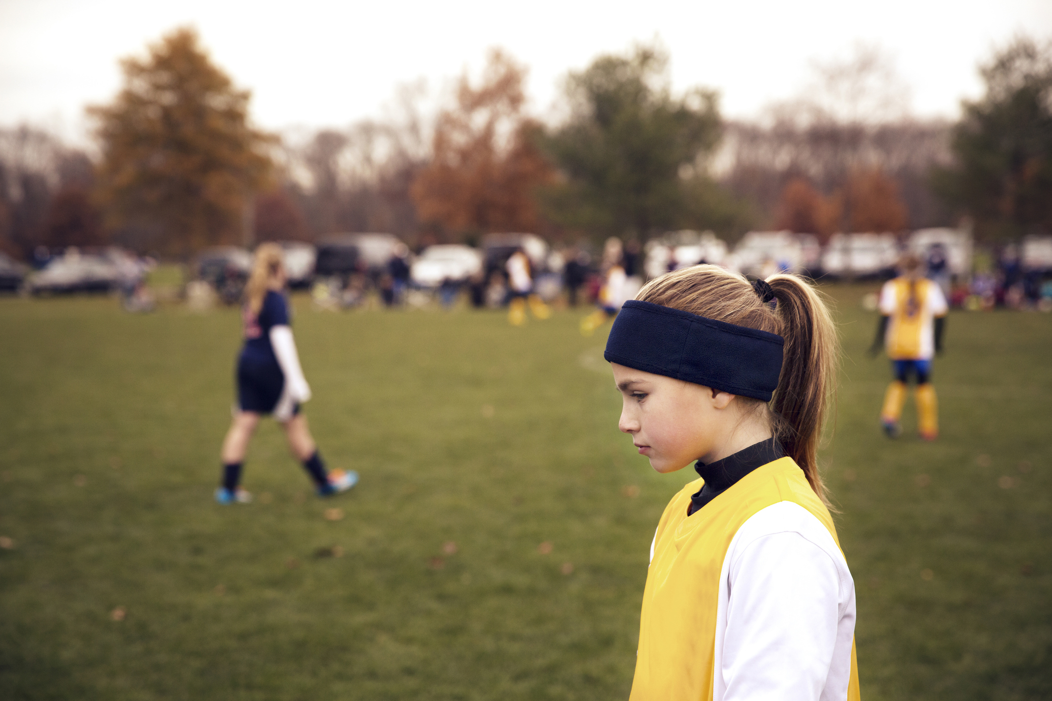 A girl is playing a soccer game