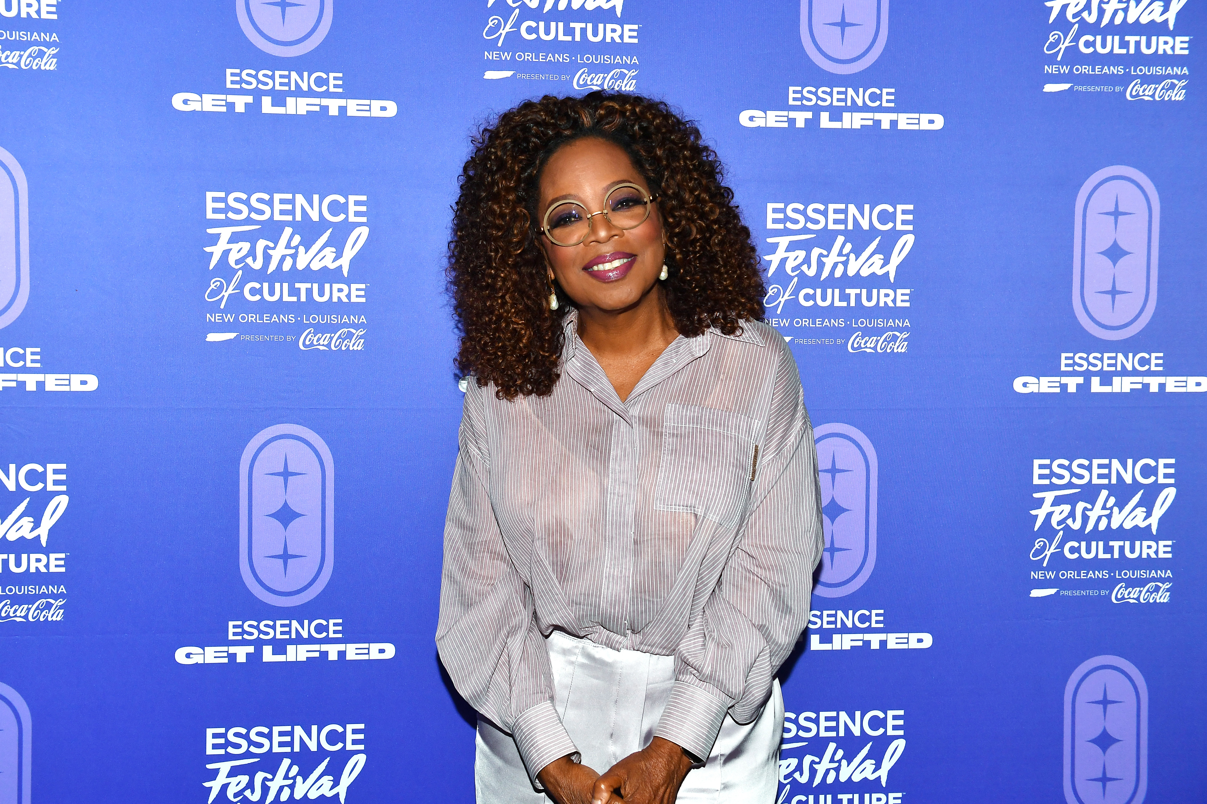 A close-up of Oprah smiling at an Essence event