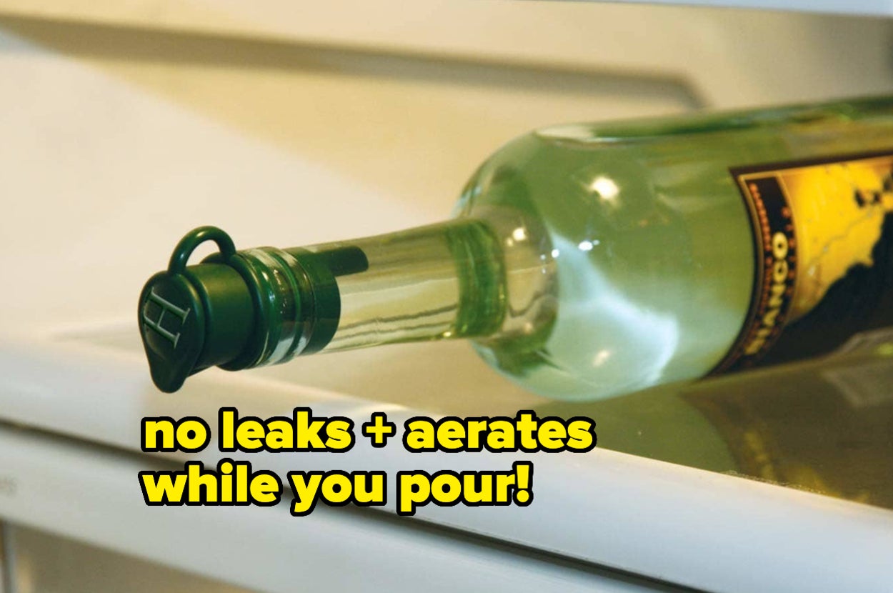 a wine bottle on its side in a fridge with a stopper that prevents leaks