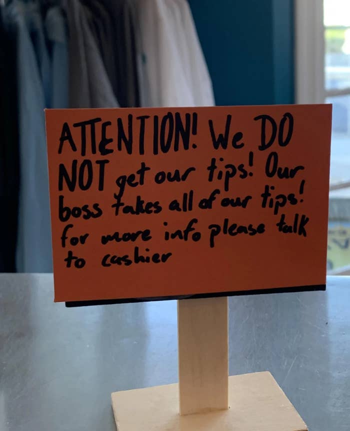 A sign posted at the front desk says &quot;attention, we do not get our tips. Our boss takes all our tips&quot;