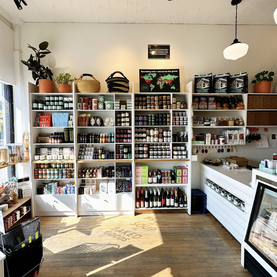 A store full of hand-made and homemade jams, preserves, bottles of wine.