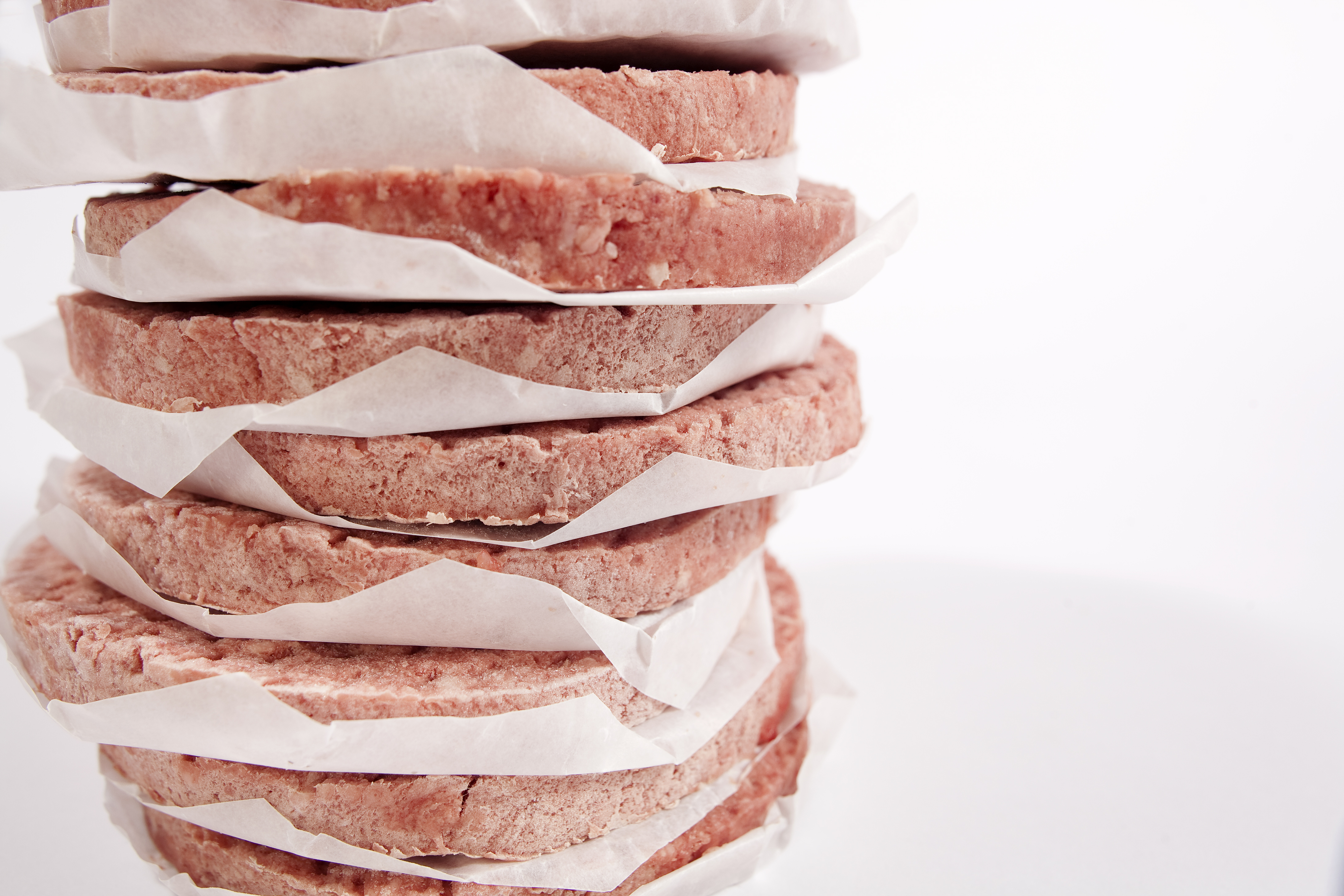 frozen burger patties with paper in between