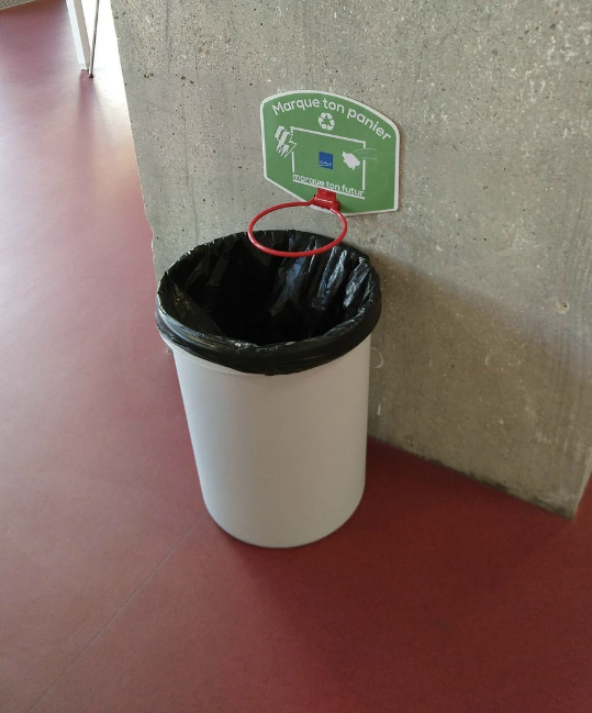 a hoop over a trash can