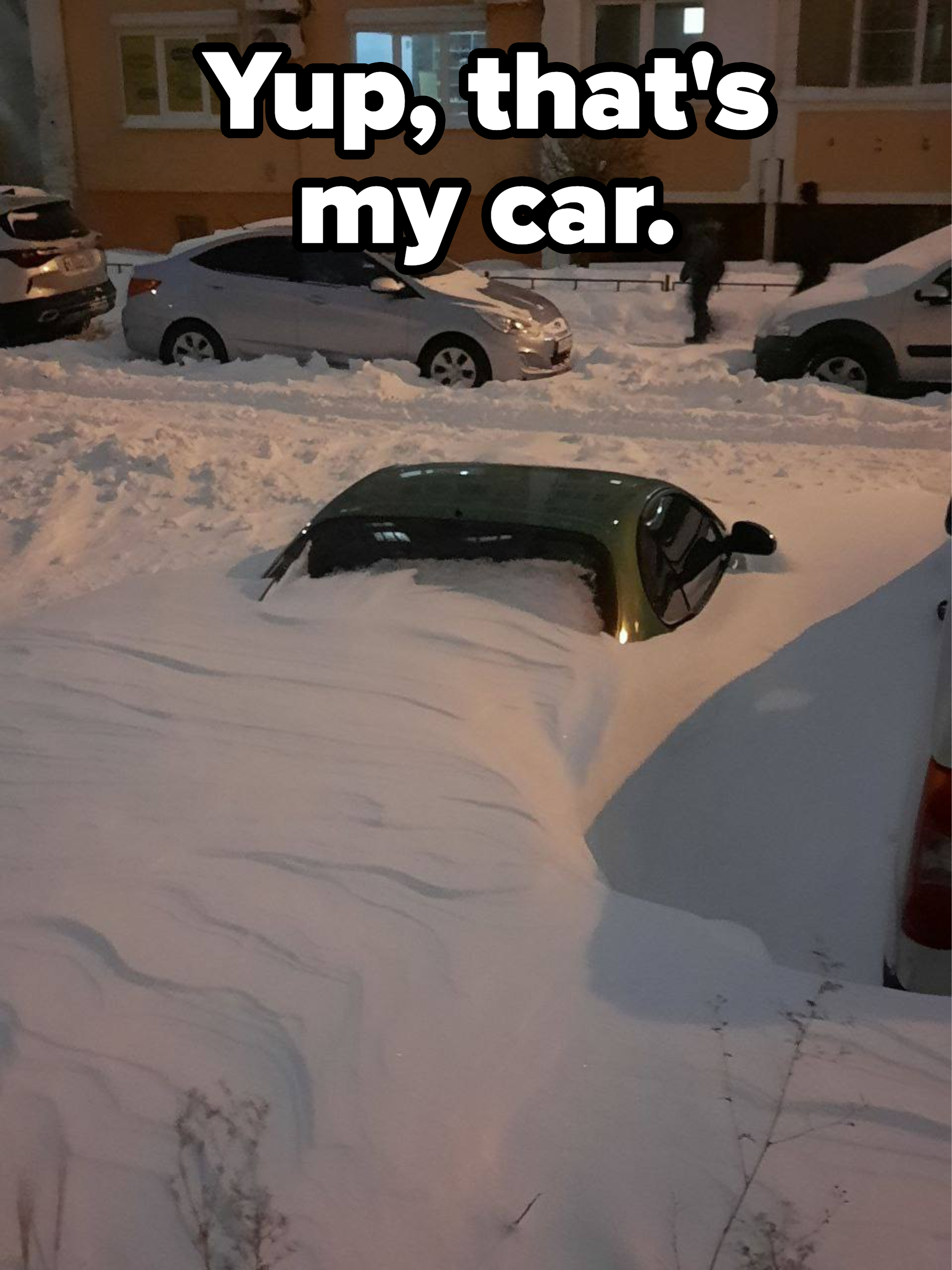a car buried in snow