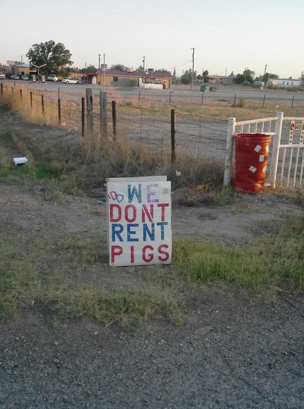A sign saying &quot;We don&#x27;t rent pigs&quot;