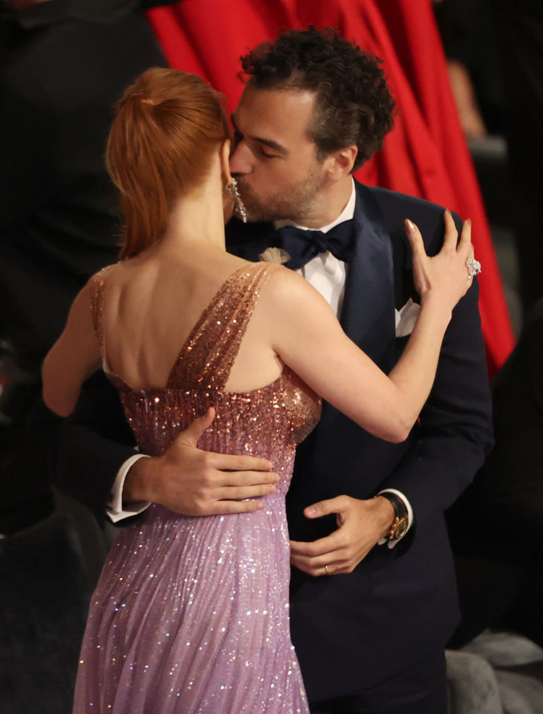Him kissing her cheek
