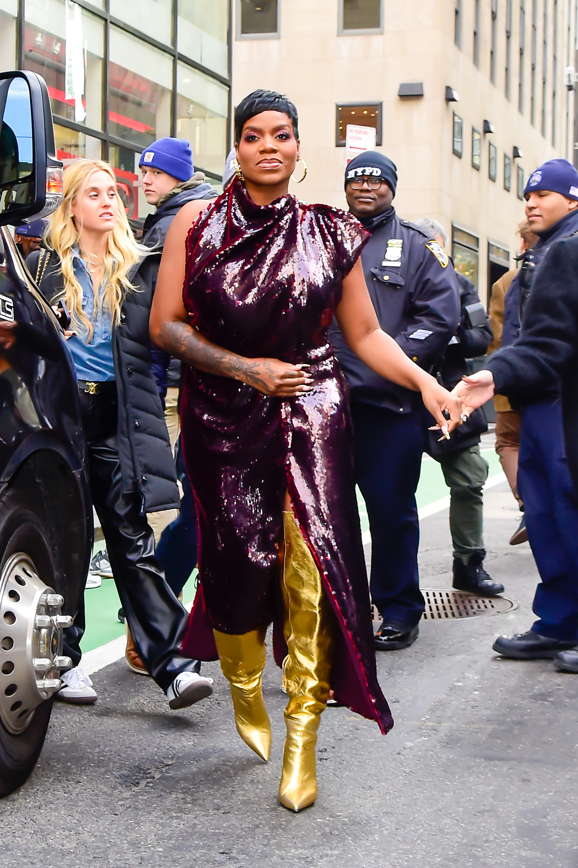 Closeup of Fantasia in a sequined dress and boots