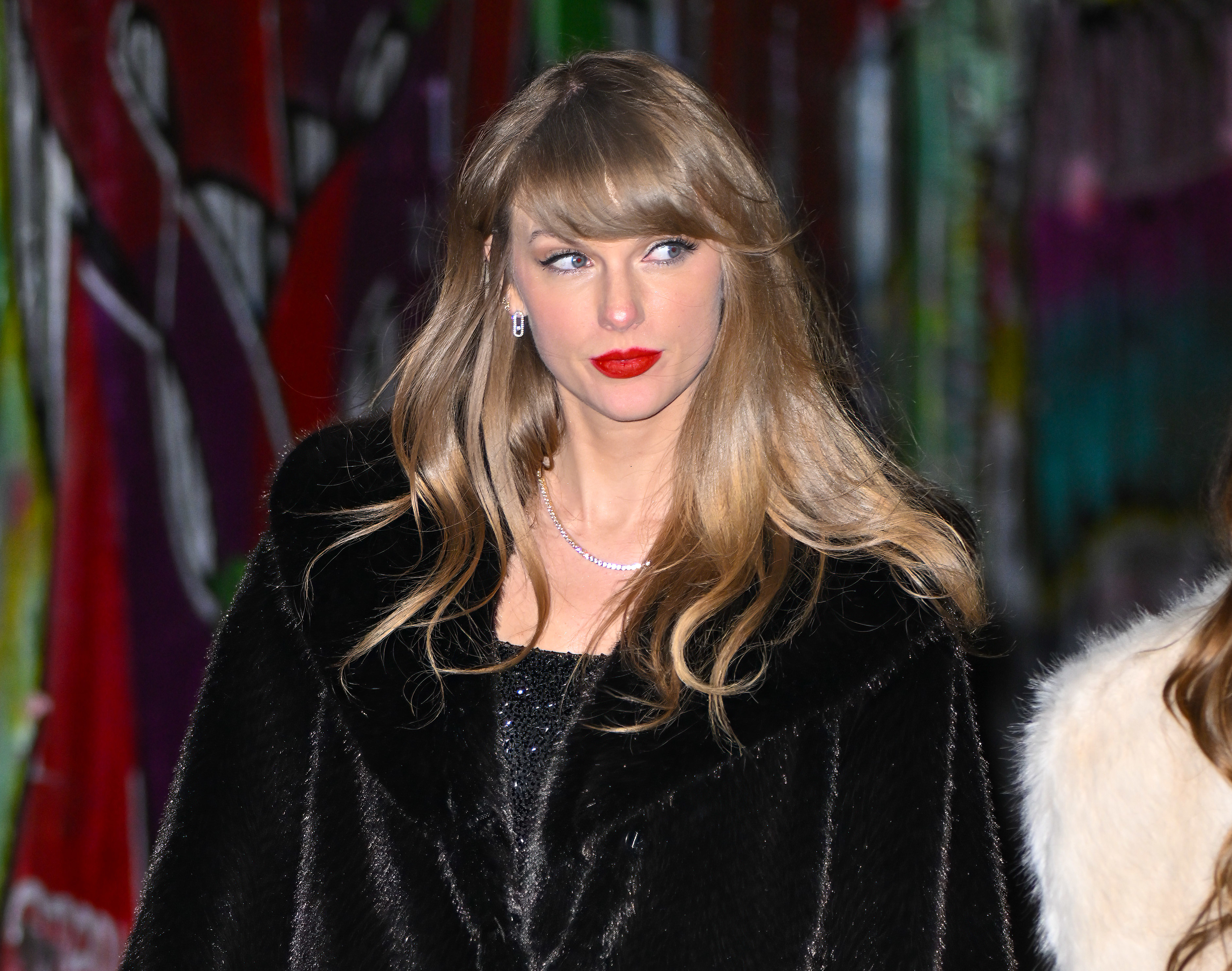 Close-up of Taylor in a furry coat