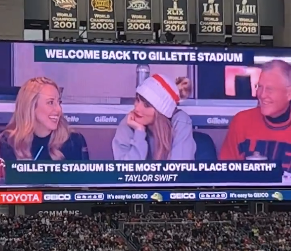 Close-up of the quote on the huge screen below an image of Taylor sitting with Brittany and her dad
