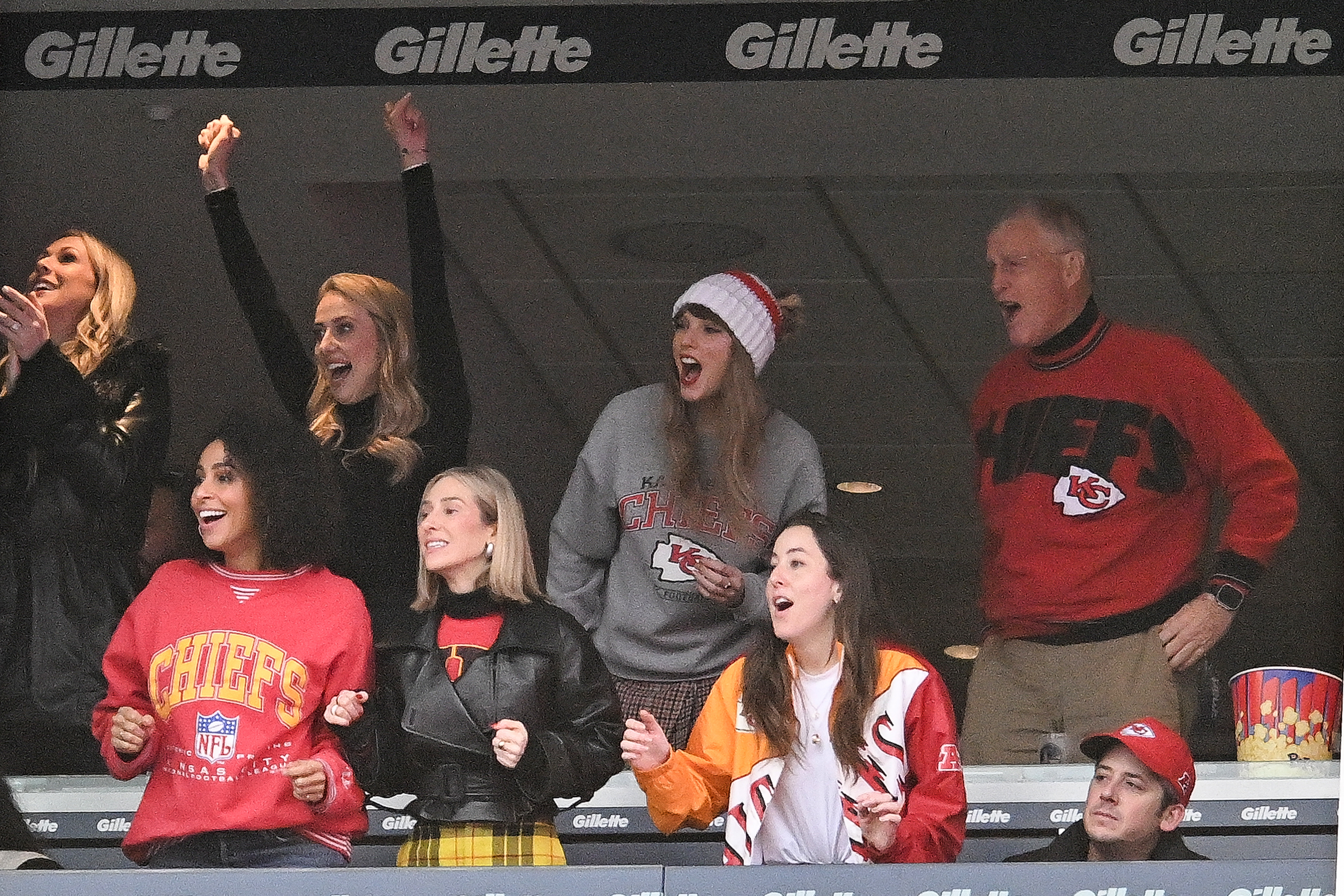 Taylor celebrating with others at a game