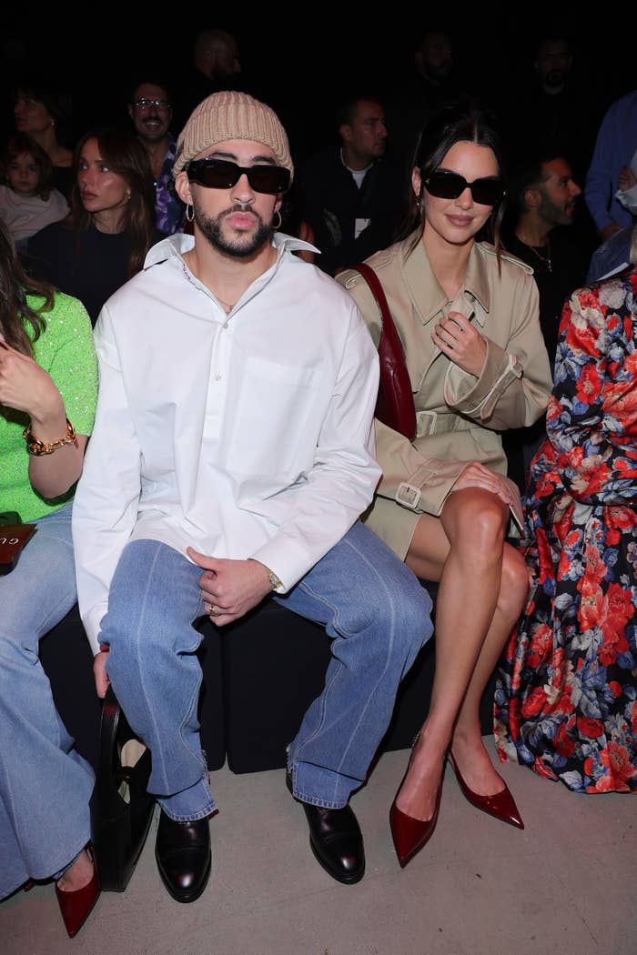 Close-up of Kendall and Bad Bunny sitting together and wearing sunglasses