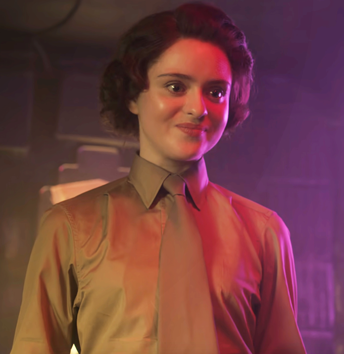 Close-up of Viola as Elizabeth smiling and wearing a blouse and tie