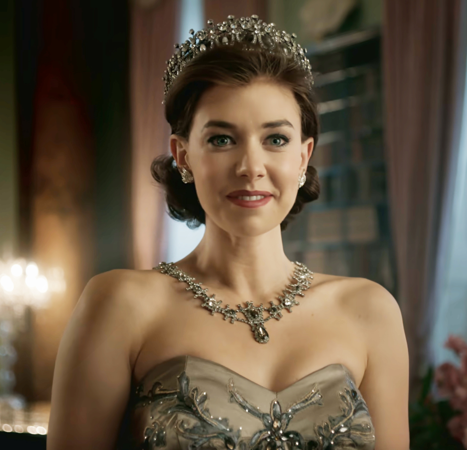 Vanessa wearing a crown and bejeweled necklace