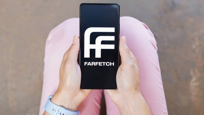 farfetch logo on phone