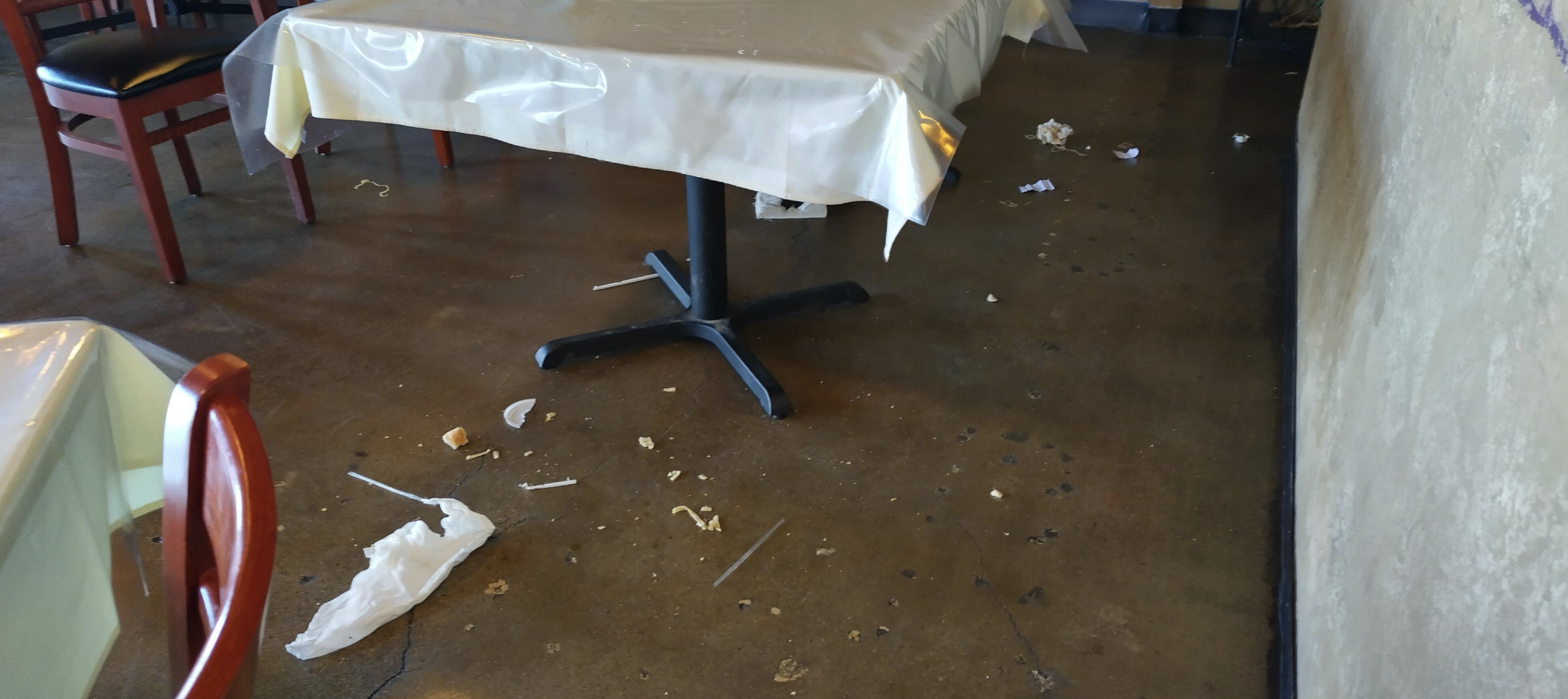 A mess on the floor in a restaurant