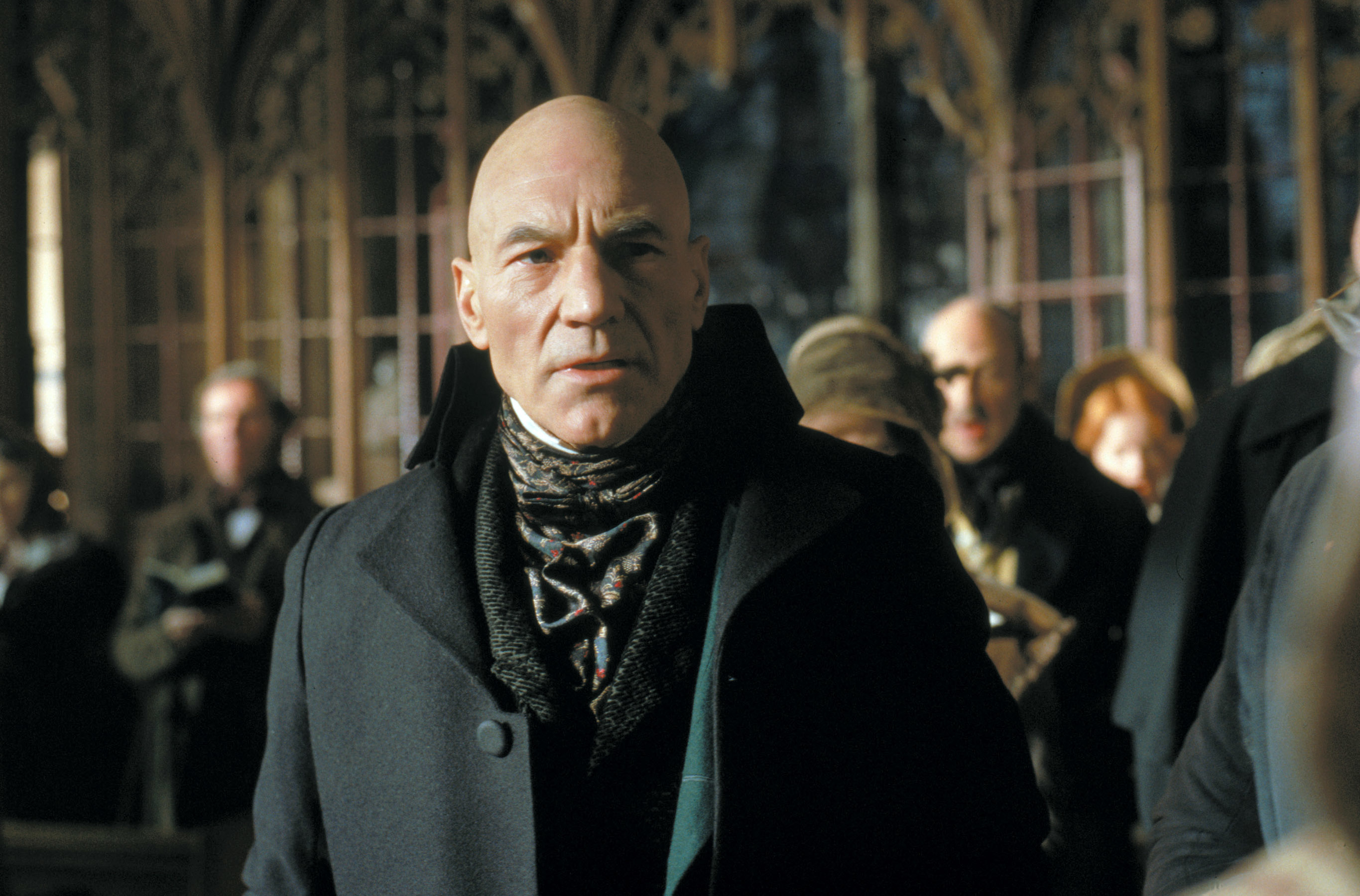 patrick stewart in a trench coat and scarf