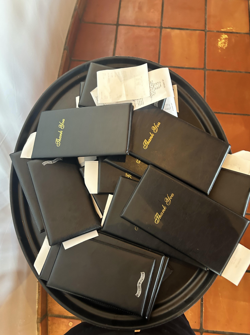 A pile of restaurant bills